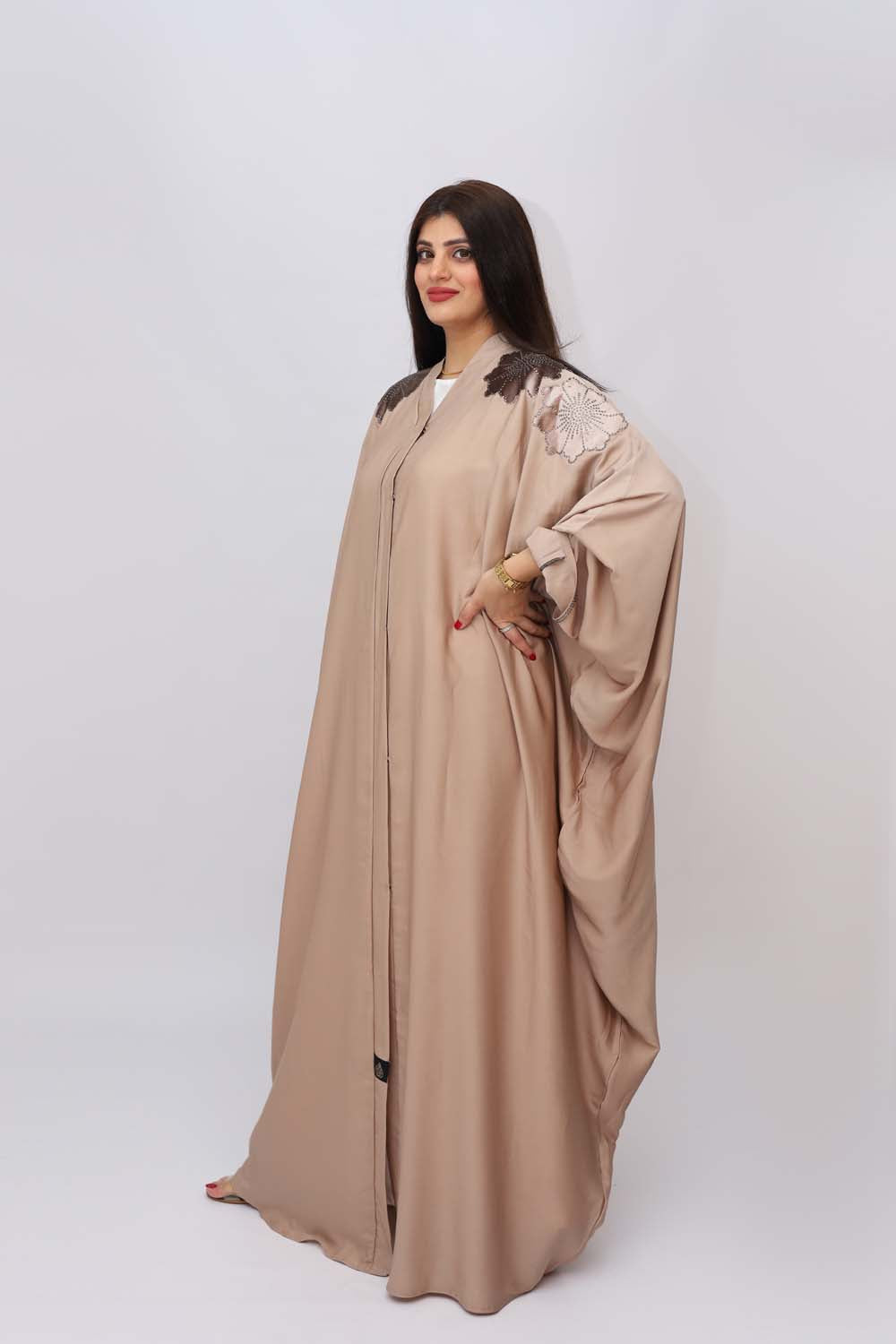 "Luxurious Velvet Apelic Silk Abaya showcased on a 5.6 feet model, featuring opulent appearance and tailored fit. Model wears size 56."