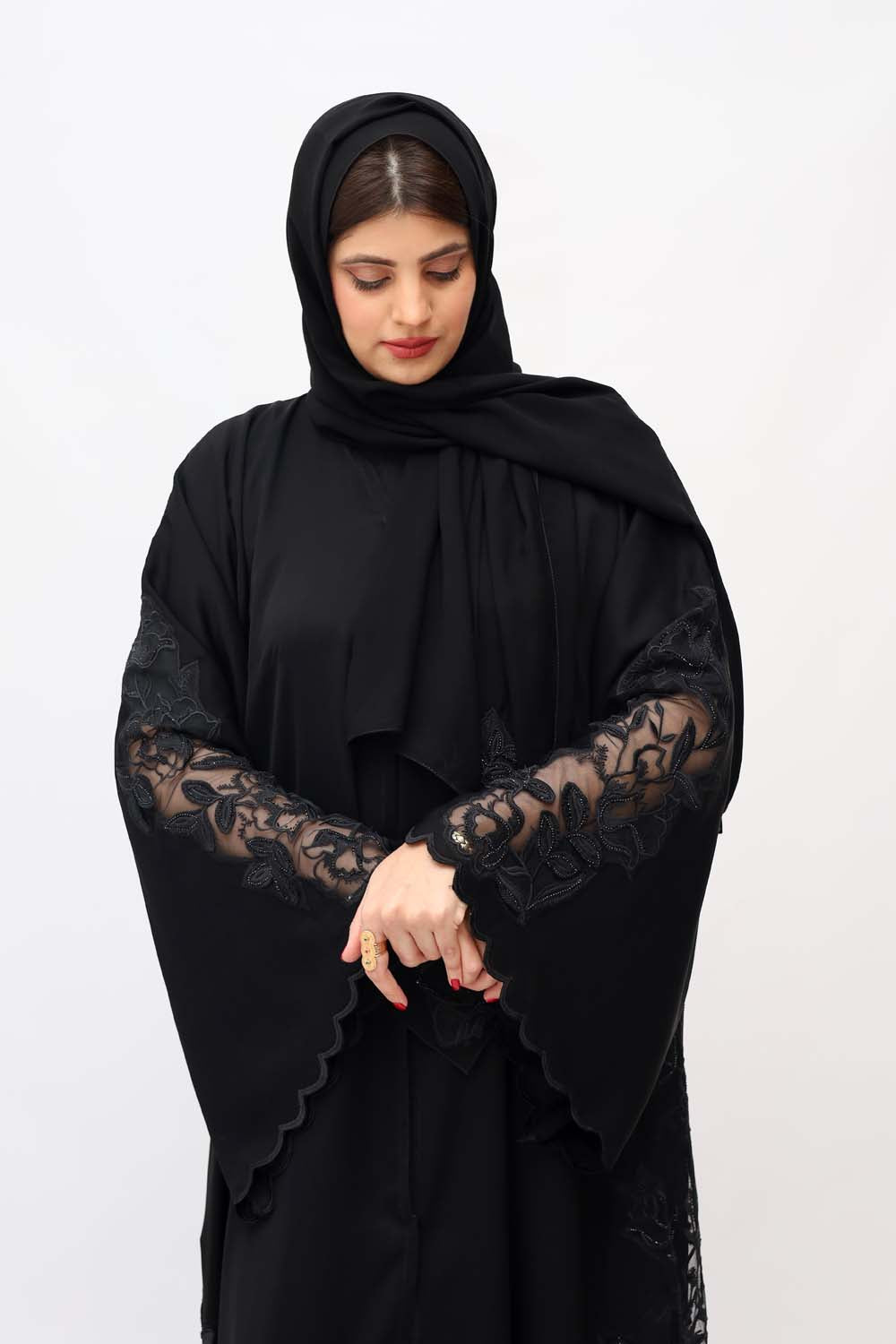 "Close-up of a Black Nida Embroidery Abaya showcasing exquisite detailing and timeless elegance."