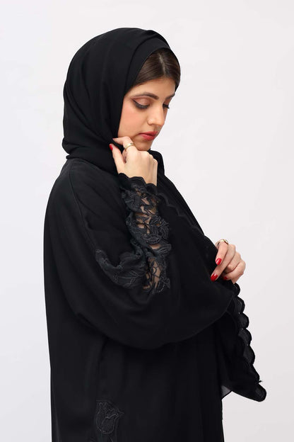 Close-up of a Black Nida Embroidery Abaya showcasing exquisite detailing and timeless elegance."