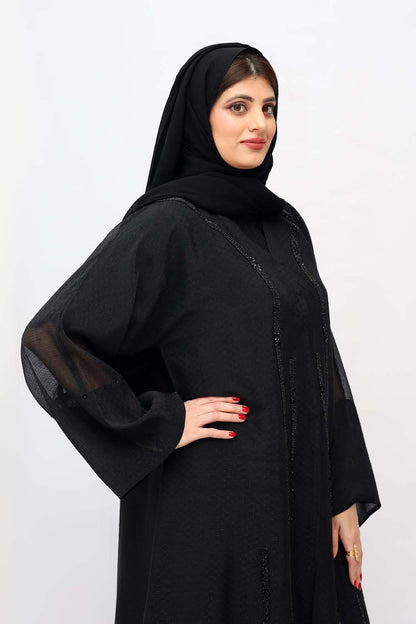 "Elegant Black Abaya with Front Beads Work showcased on a 5.6 feet model, blending traditional modesty with contemporary style."