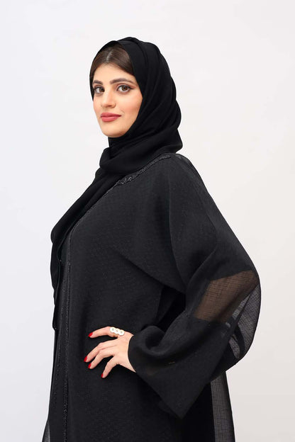 "Elegant Black Abaya with Front Beads Work showcased on a 5.6 feet model, blending traditional modesty with contemporary style."