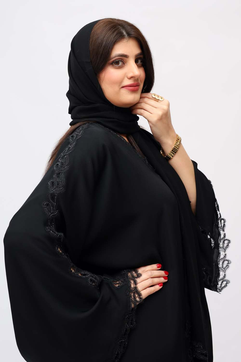 "Elegant Black Beads Cutwork Abaya showcased on a 5.6 feet model, featuring intricate details and sophisticated bead embellishments."