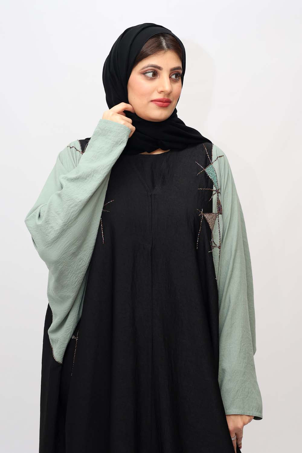 "Elegant Kaftan Style Beads Work Abaya showcased on a 5.6 feet model, blending traditional charm with modern sophistication. Model wears size 56."