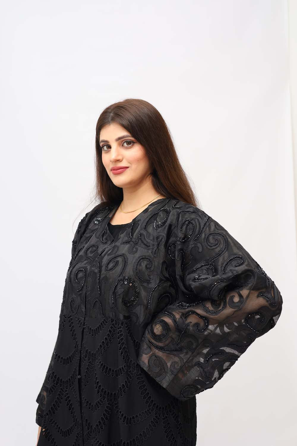 "Elegant Chickenkari Net Style Abaya showcased on a 5.6 feet model, featuring feminine embroidery and a tailored fit. Model wears size 56."