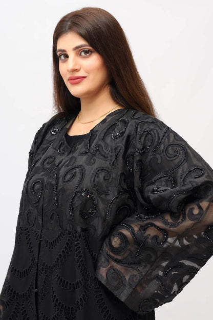 "Elegant Chickenkari Net Style Abaya showcased on a 5.6 feet model, featuring feminine embroidery and a tailored fit. Model wears size 56."