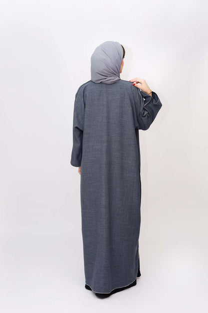 "Elegant Grey Stones Work Abaya showcased on a 5.6 feet model, featuring intricate stone embellishments and a tailored fit. Model wears size 56."