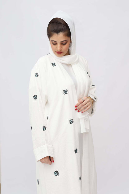 "Elegant White Embroidery Abaya showcased on a 5.6 feet model, featuring intricate detailing and a tailored fit. Model wears size 56."