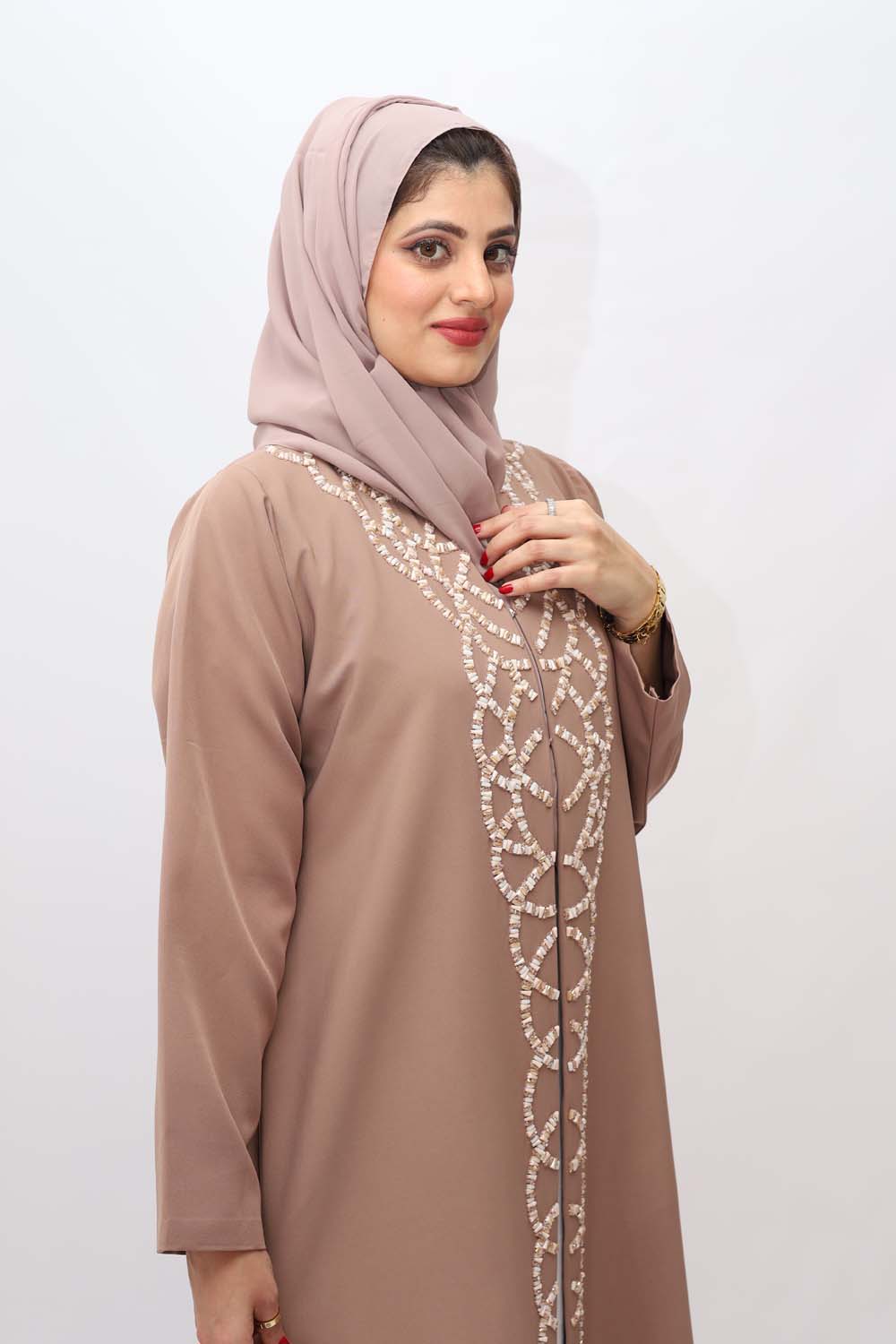 "Elegant Handmade Stones Front Abaya showcased on a 5.6 feet model, featuring front stones embellishment and a tailored fit. Model wears size 56."